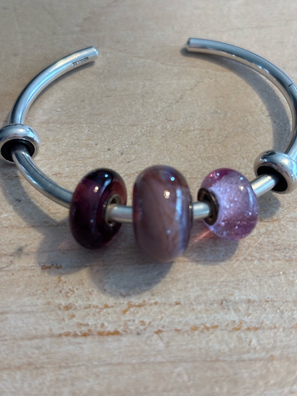 Glass lamp work beads with sterling silver core.